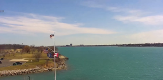 View of the Detroit River from a boat, showcasing the lake and surrounding scenery near the Dossin Museum.